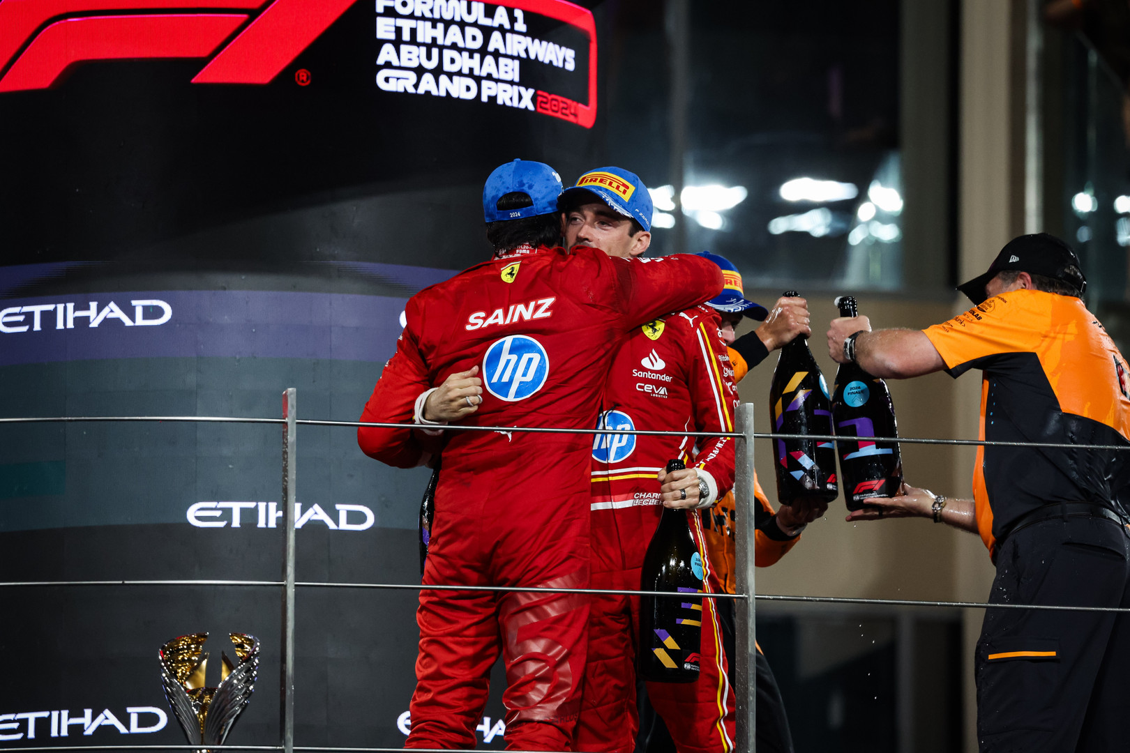 Charles Leclerc and Carlos Sainz on podium in Abu Dhabi