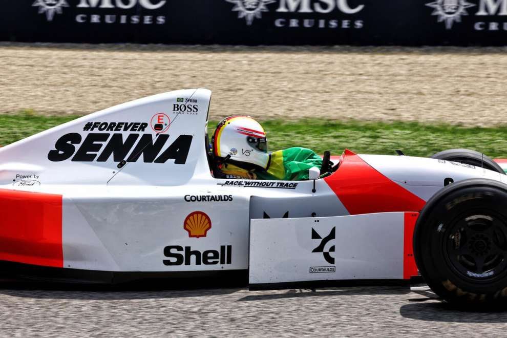 Sebastian Vettel driving Ayrton Senna's McLaren MP4/8